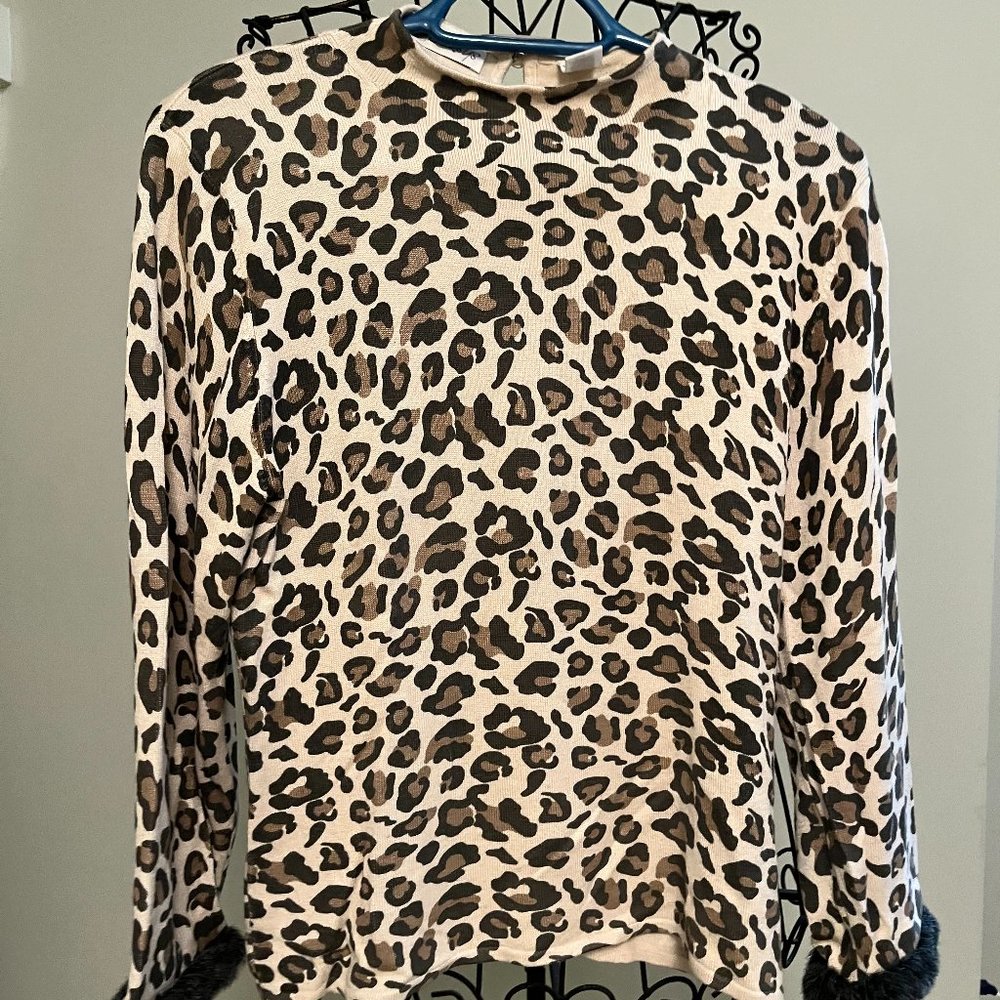 Betsy's knit leopard print sweater with faux fur wrists